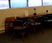 a desk with chairs