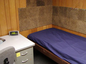 A bed next to a desk